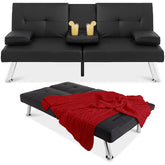 A stylish black leather couch with a warm red blanket resting on its side.